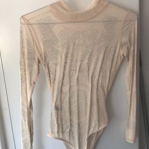 Beautiful cream started body suit